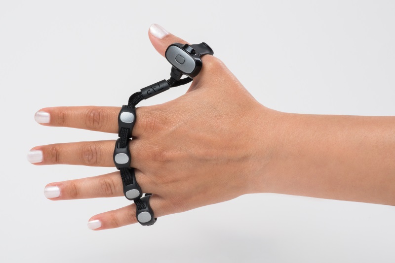 Tap on left hand A left hand wearing the Tap keyboard. Tap is ambidextrous and can be worn on either hand.