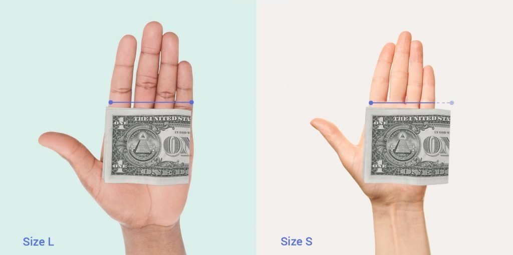 Image of a folded dollar bill resting on top of a palm where the width of the fingers and palm is less than the width of the folded bill and where it is wider than the bill.