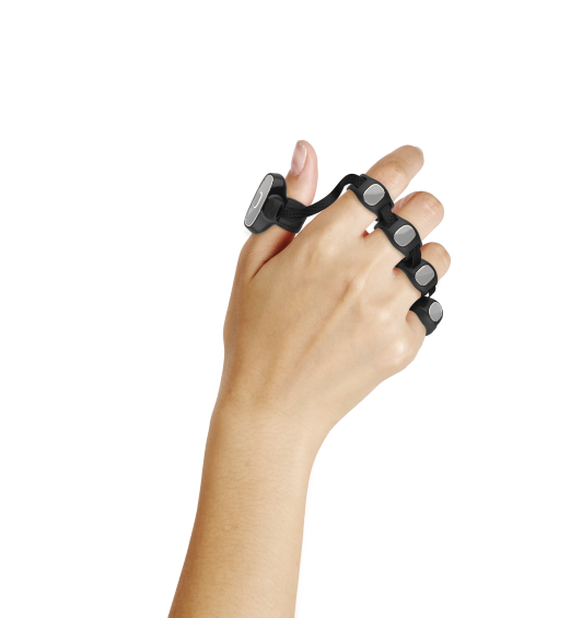 Image of a hand wearing Tap. Tap should sit at the base of your fingers like 5 rings.